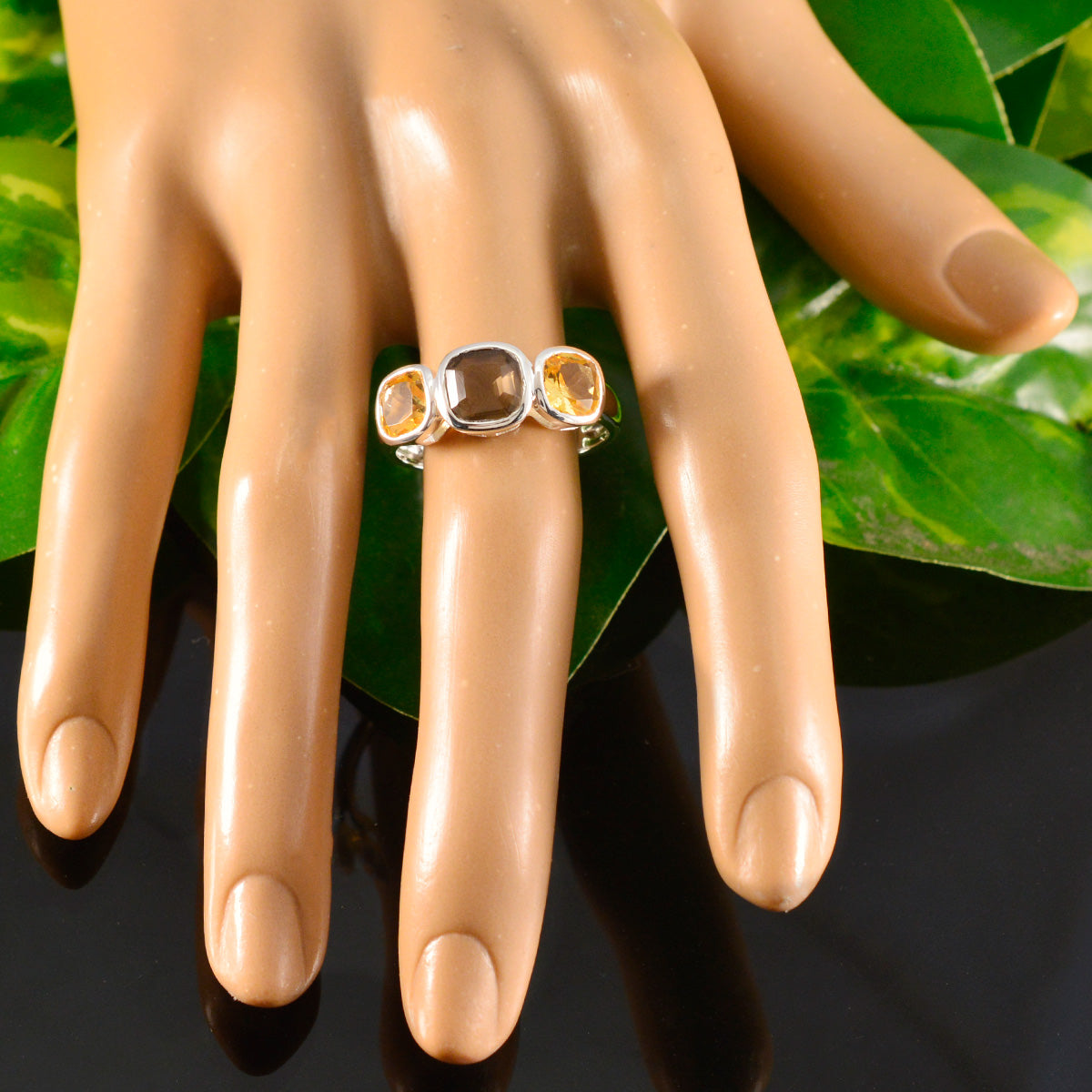 Saanvi multicolor gemstone trilogy ring with three distinct gemstones on silver band displayed on hand
