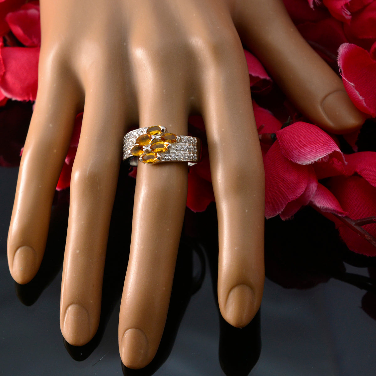 Teresa yellow gemstone ring for women with multiple yellow stones and silver band on mannequin hand