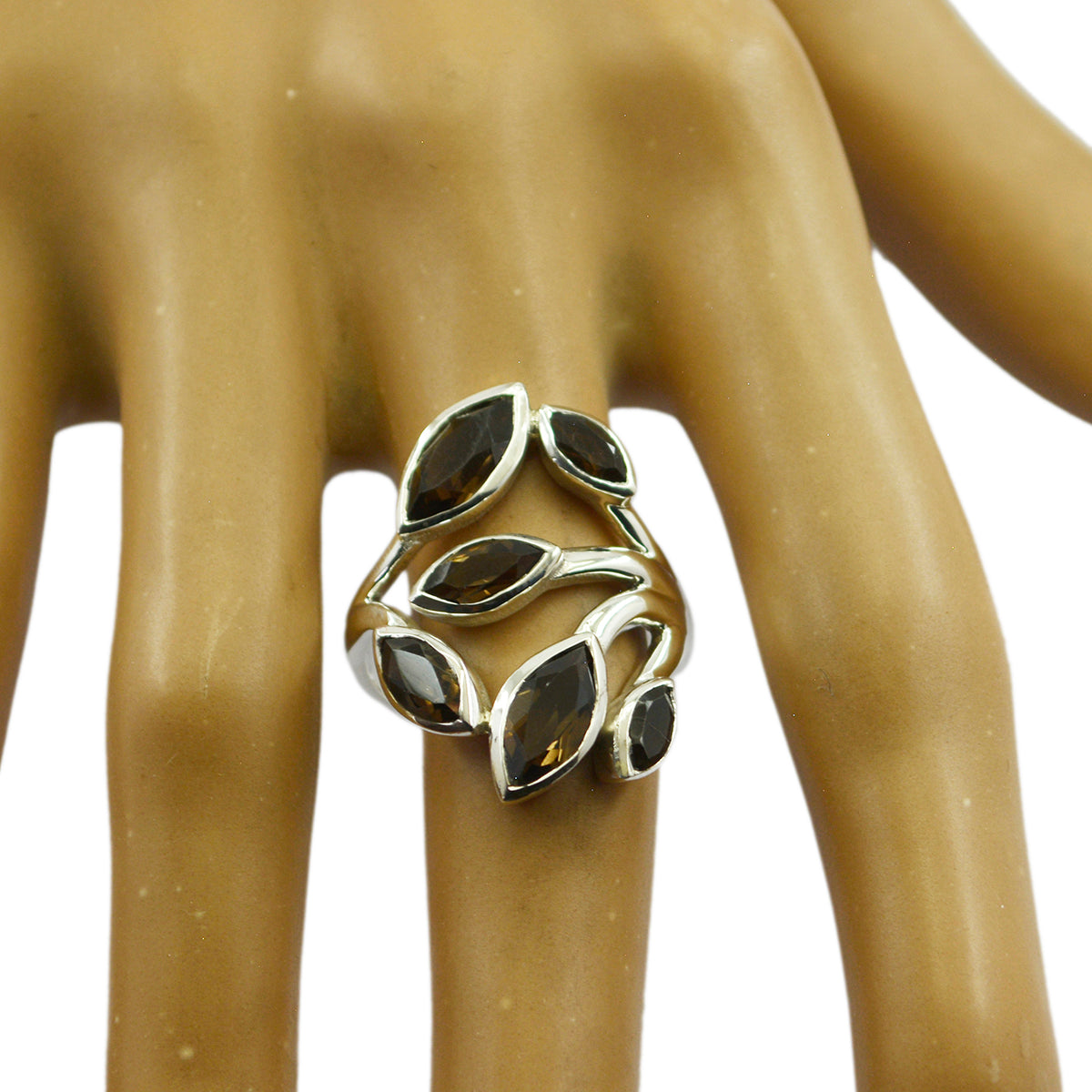 Genesis leafy brown gemstone ring with marquise-shaped stones set in silver on a display hand