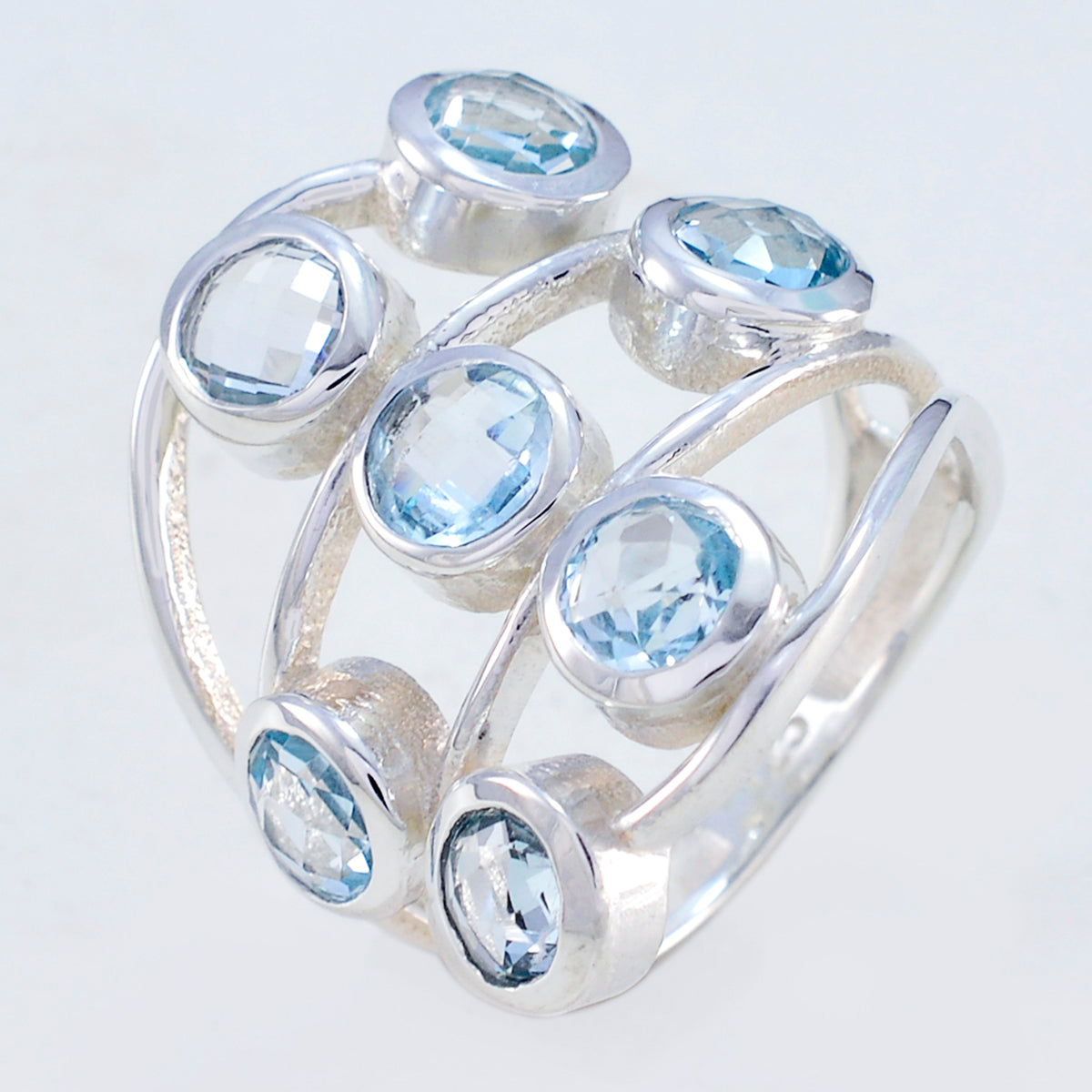 Camila luxurious blue gemstone ring with multiple round blue stones set in silver band