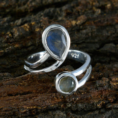 Saanvi luxurious grey toi et moi ring with two grey gemstones in silver setting on natural wood