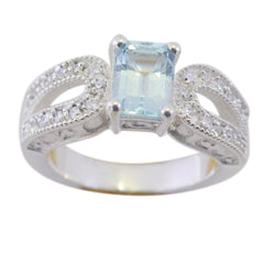 Julia modern blue halo ring with rectangular blue center stone and sparkling pave band