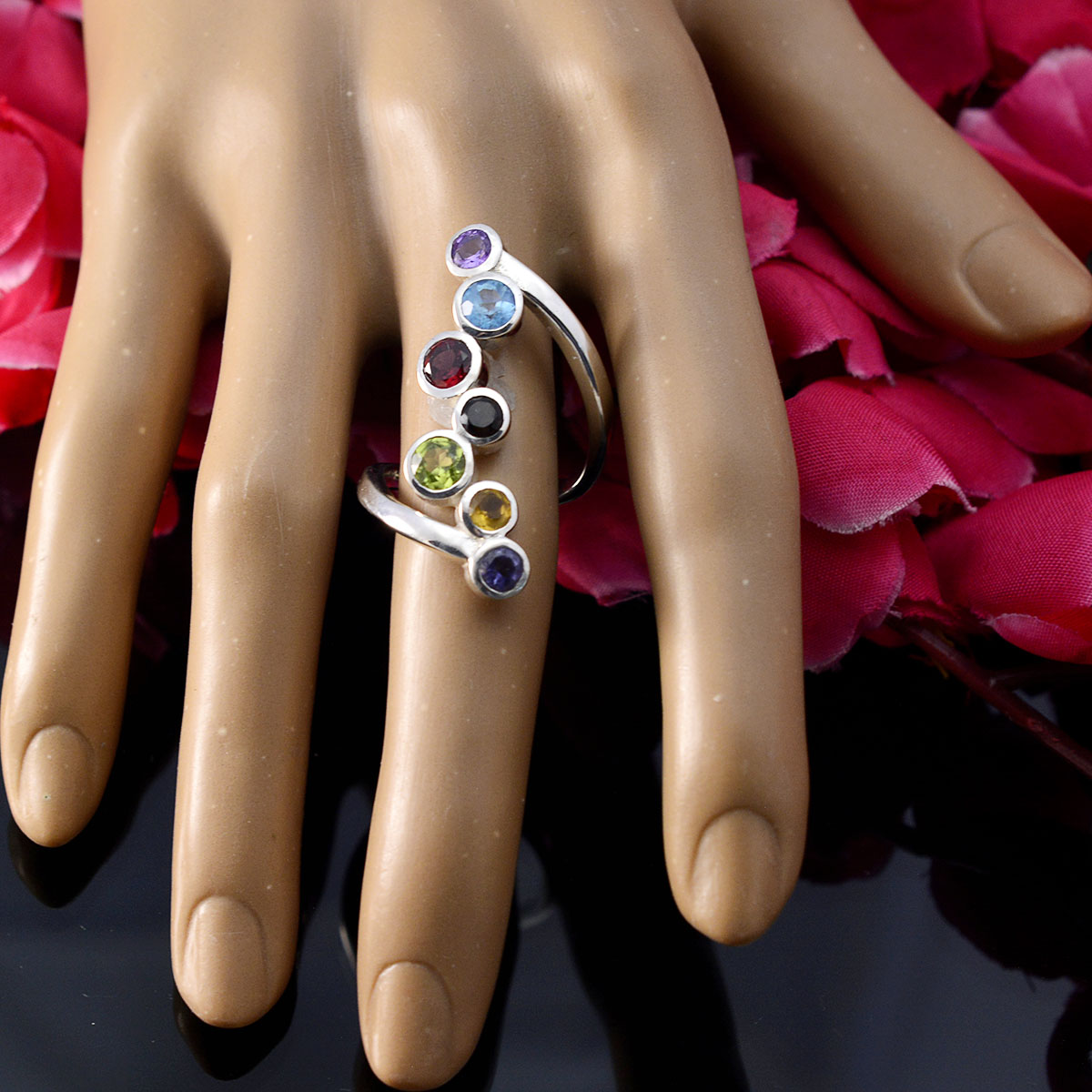 Laura modern multicolor gemstone ring with seven colorful stones on silver band worn on hand