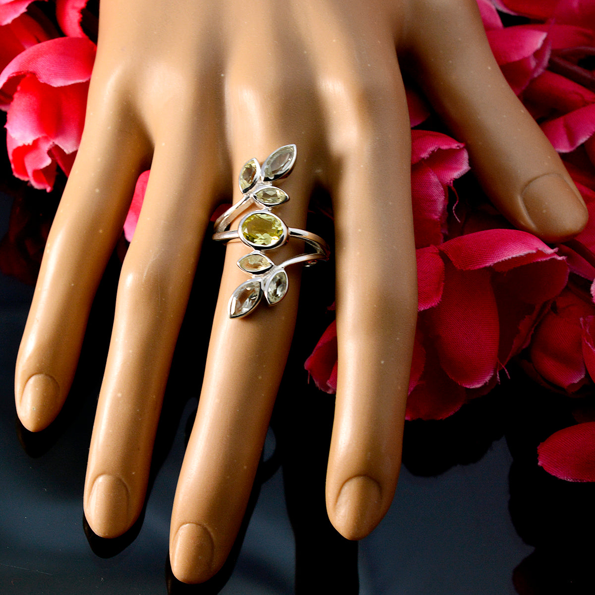 Valentina multicolor gemstone cocktail ring on mannequin hand with silver leaf cluster and yellow center