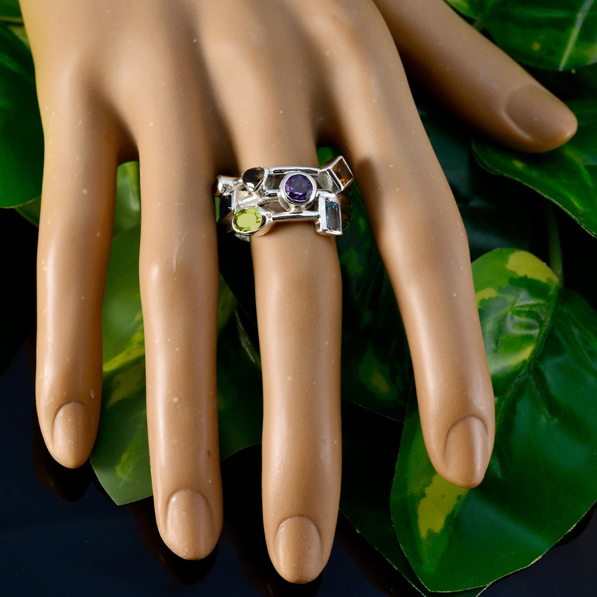 Sarah multicolor gemstone cocktail ring featuring various gemstone shapes on a silver band worn on a hand