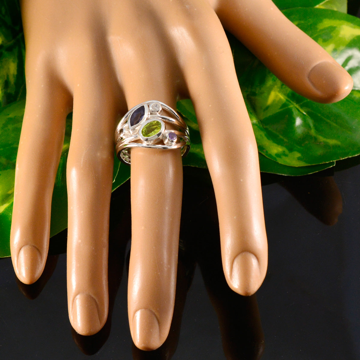 Liyana multicolor gemstone ring with various colored stones set in silver band on mannequin hand