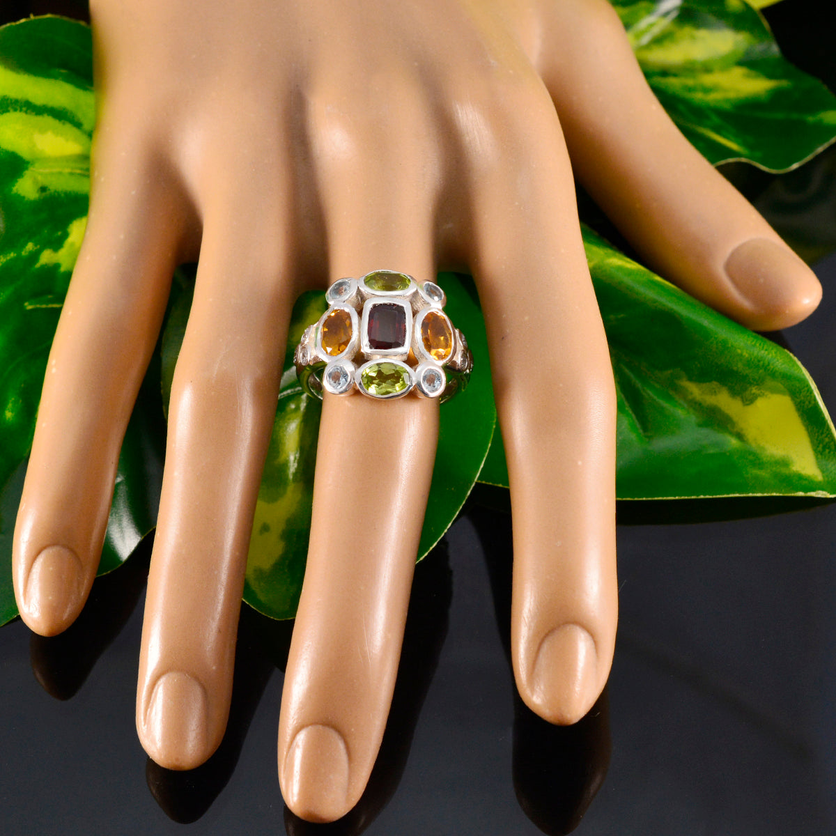 Julieta multicolor navratna ring with central deep red gemstone and peridot citrine accents on silver band