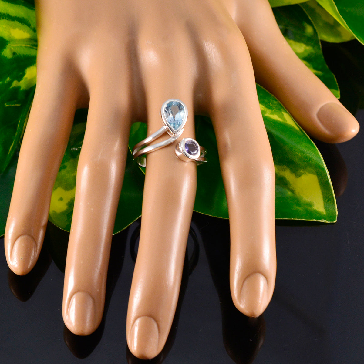 Ivy multicolor toi et moi ring with two different gemstone settings on silver band displayed on mannequin hand