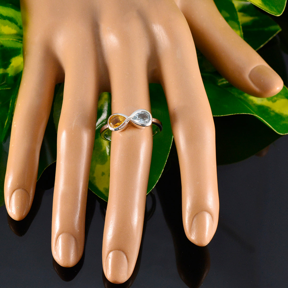 Jia multicolor toi et moi ring with yellow and clear stones on a mannequin hand