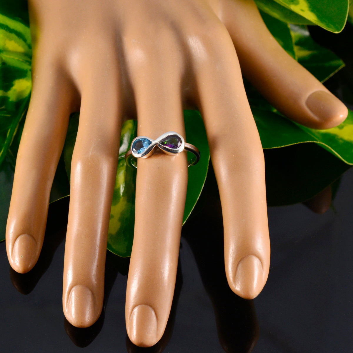 Jiwoo multicolor toi et moi ring on mannequin hand silver band with blue and purple gemstones