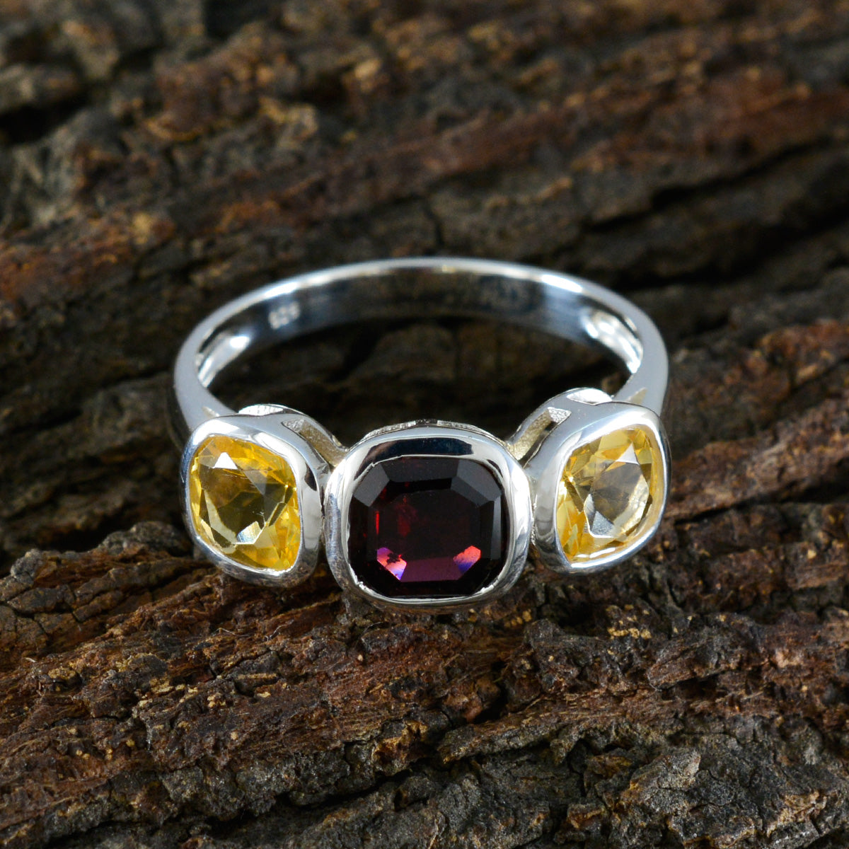Milagros multicolor trilogy ring with red and yellow gemstones set in silver band