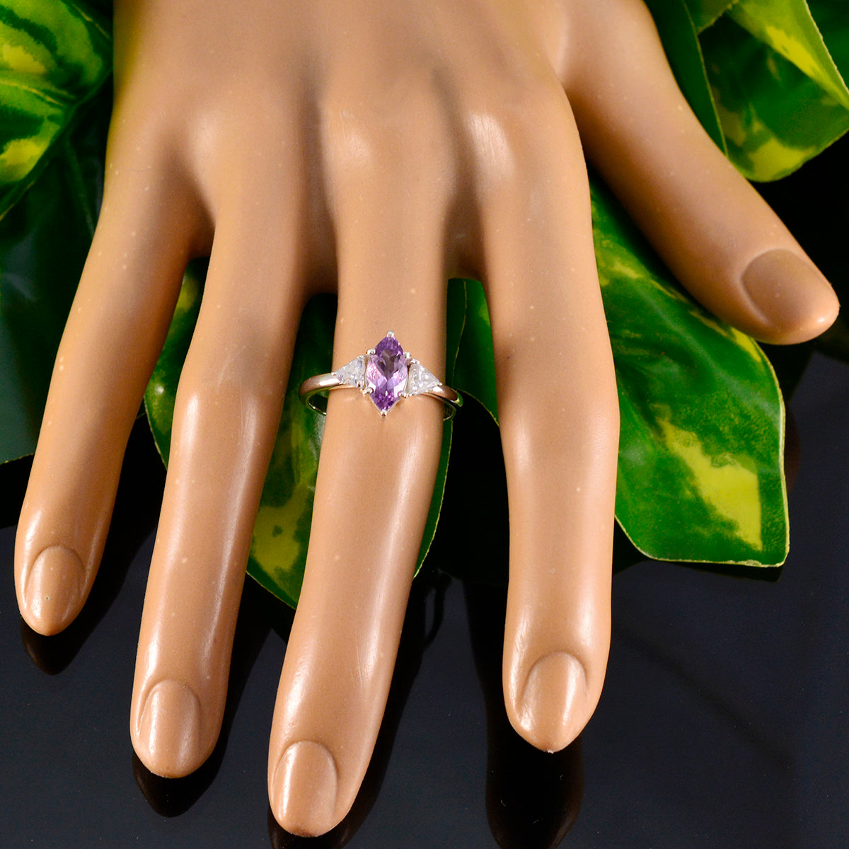 Ha-eun purple gemstone fashion ring with marquise cut stone on display hand