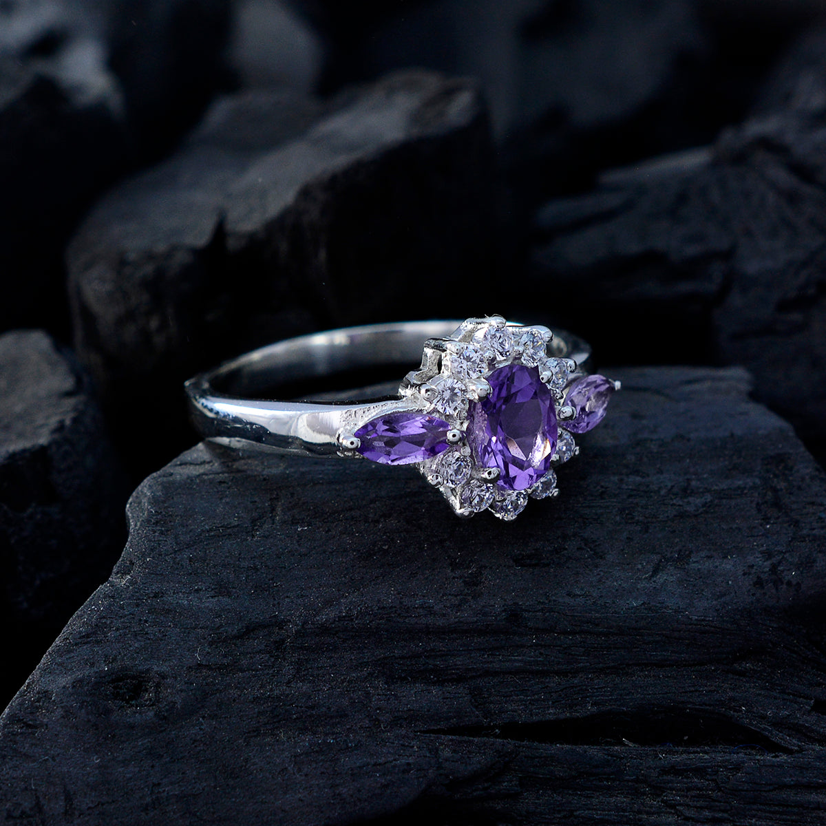 Lily purple gemstone trilogy ring with oval center stone and marquise side stones on silver band