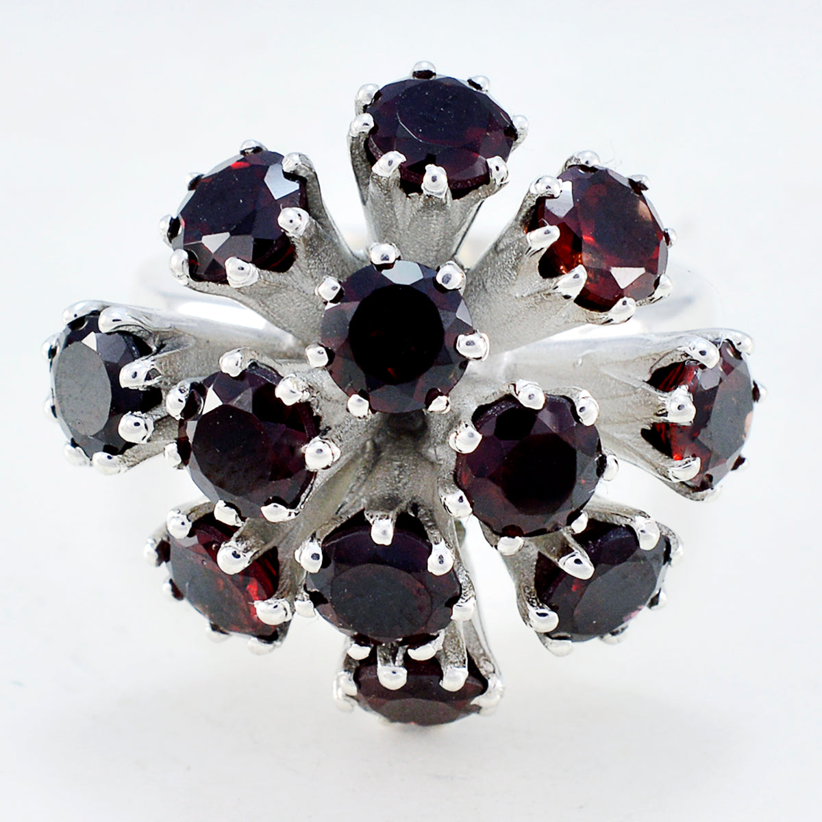 Chloe red gemstone statement ring with multiple deep red stones in silver setting