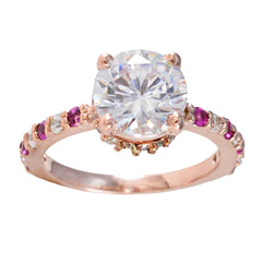 Li Lee red halo gemstone ring with large clear center stone and smaller red and clear gemstones on rose gold band