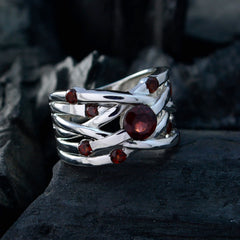 Mariana silver red navratna ring for women with multiple red gemstones on dark background