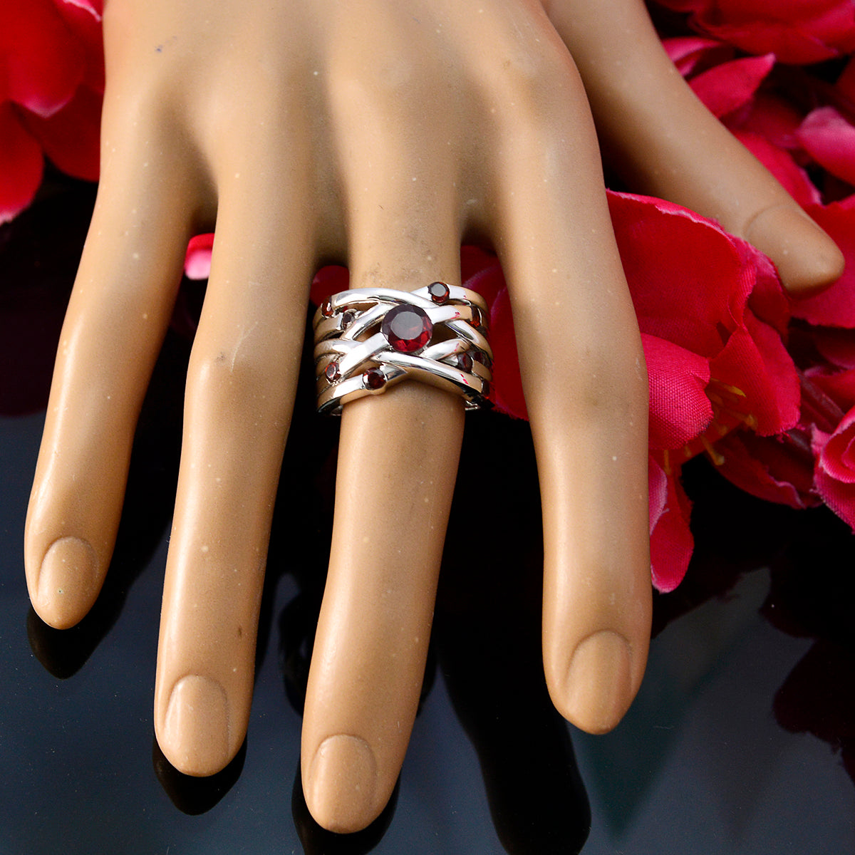 Mariana red navratna ring for women with silver band and red gemstones on display hand