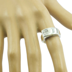 Katarina white solitaire ring for women with square clear stone and modern wide silver band on display hand