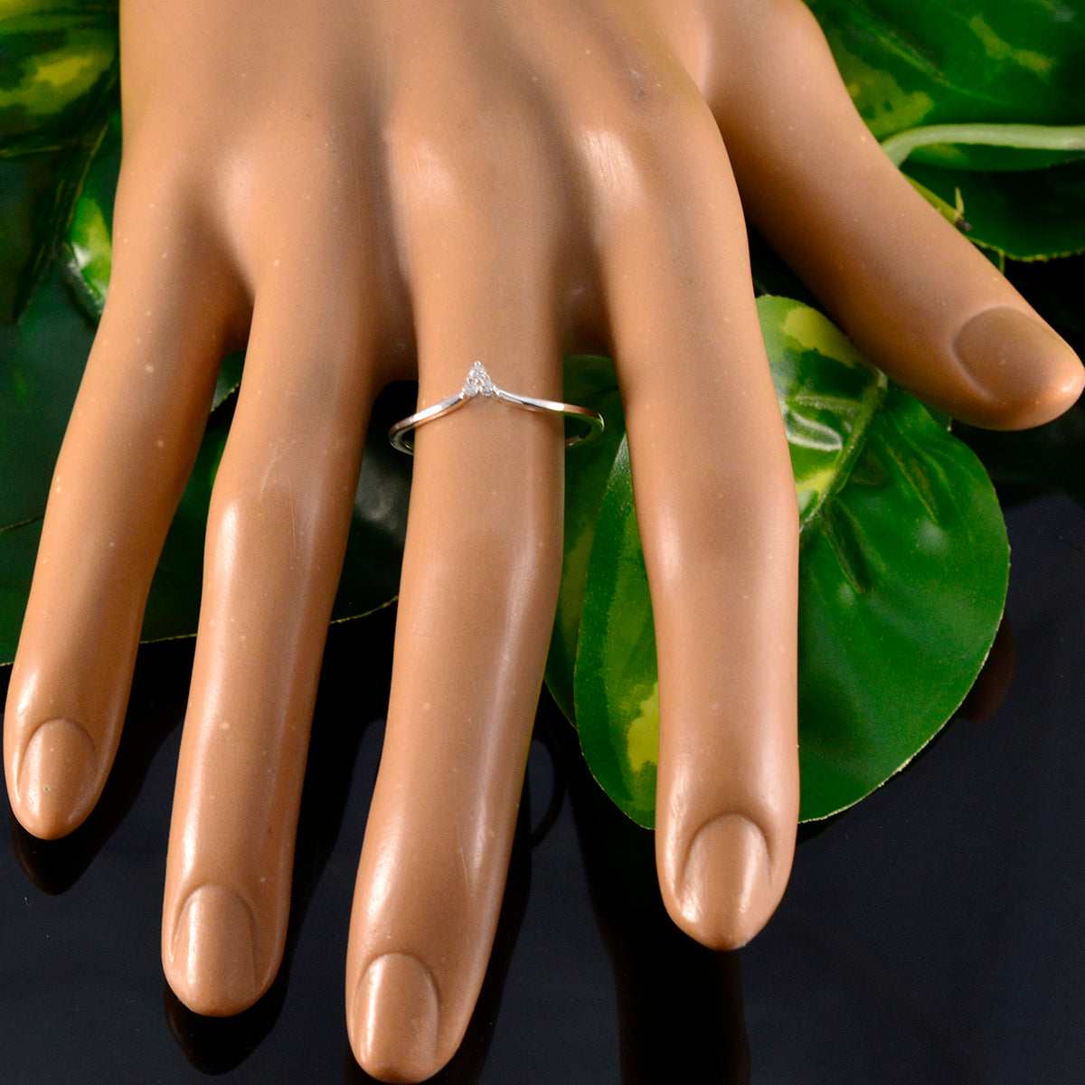 Katharina white trilogy ring for women on mannequin hand with silver band and small triangle center stone