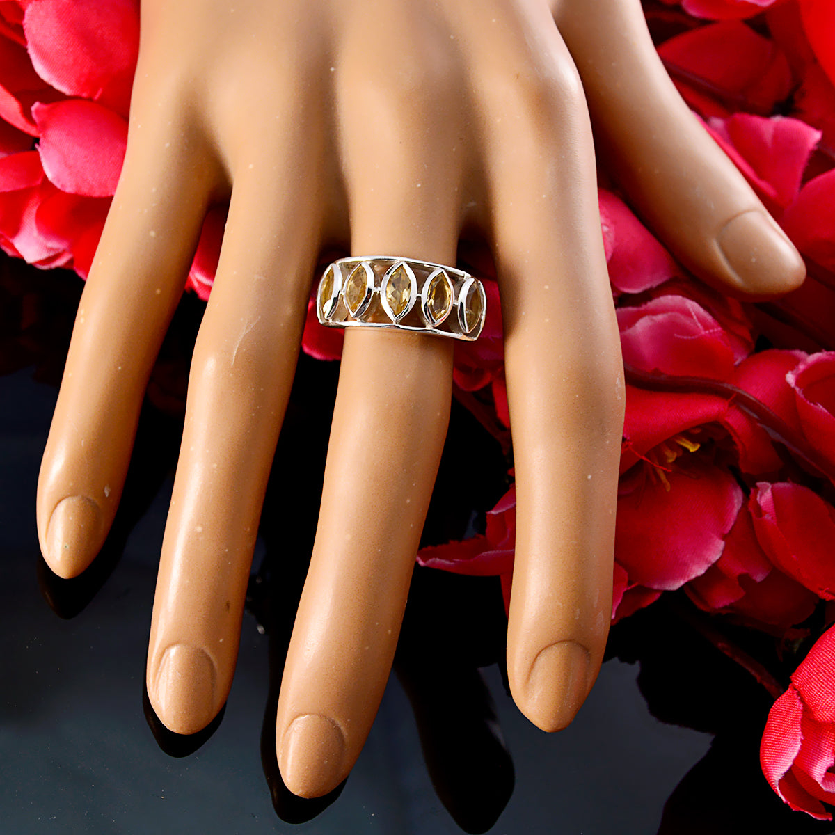 Natalie yellow gemstone ring with multiple oval gems set in silver band on mannequin hand
