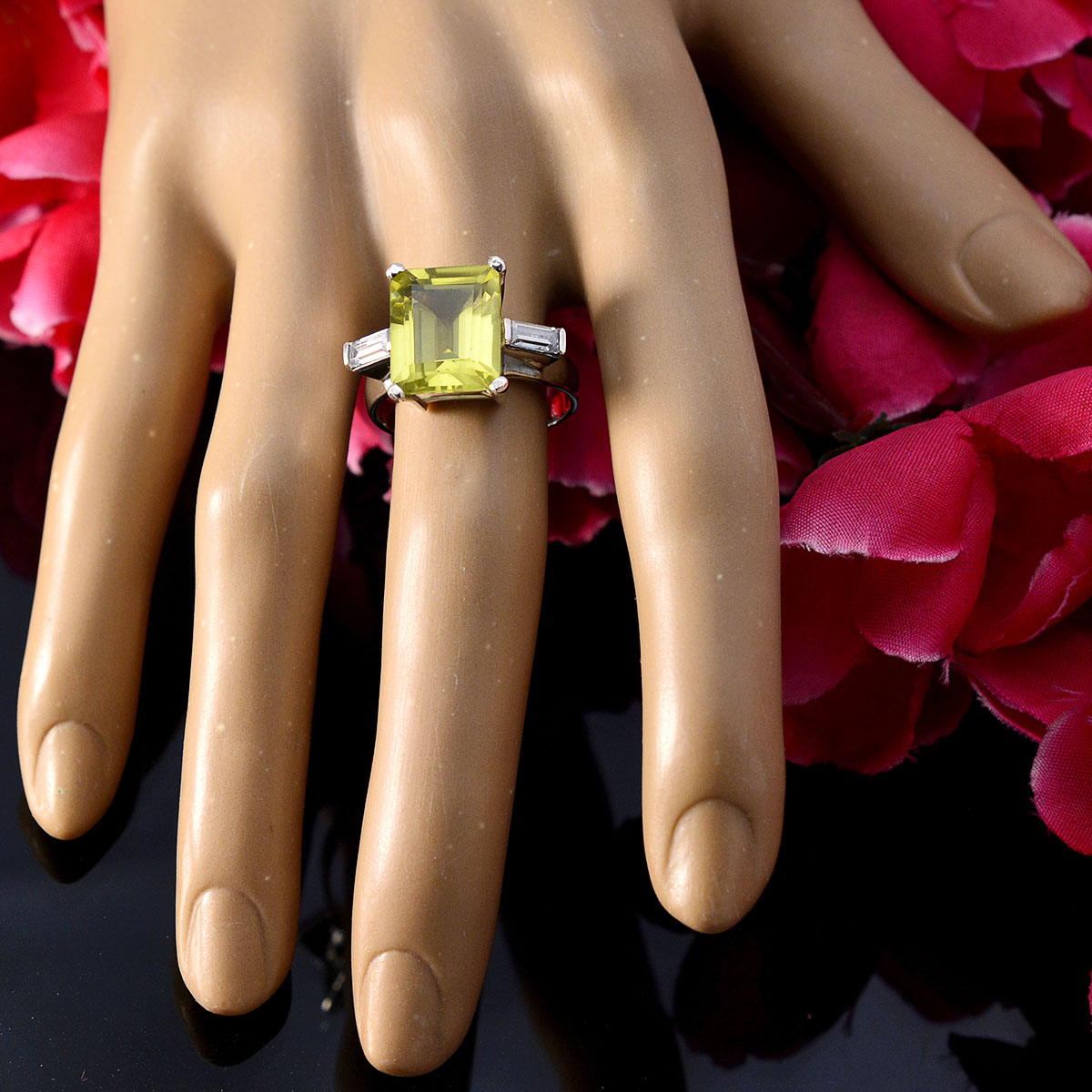 Mila yellow gemstone trilogy ring with rectangular yellow stone and side diamonds on mannequin hand