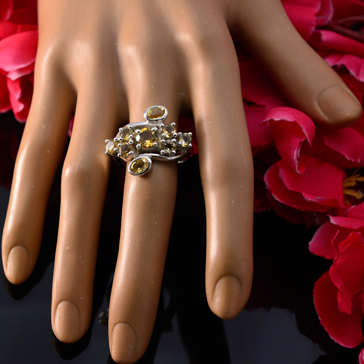 Putri yellow navratna ring in sterling silver with clustered yellow gemstones on display hand