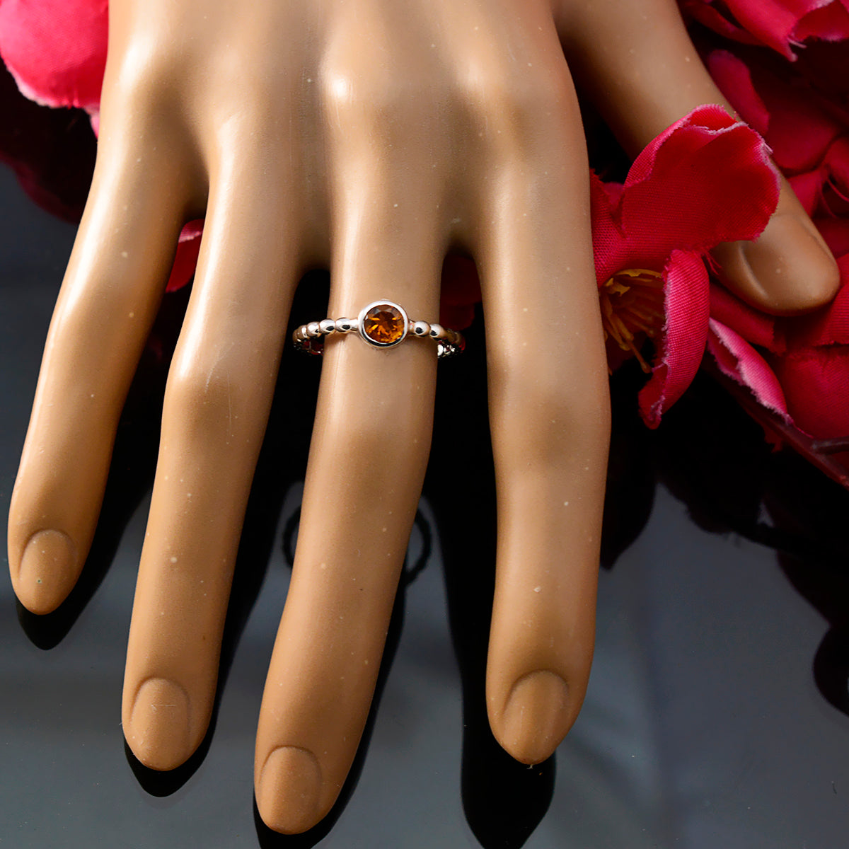Saanvi yellow solitaire ring for women with round citrine center and beaded sterling silver band on mannequin hand