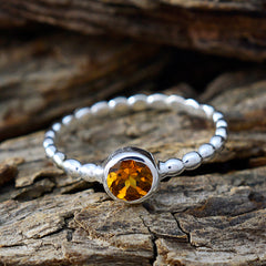 Saanvi silver beaded band ring with bezel set yellow citrine on wood background yellow solitaire ring for women