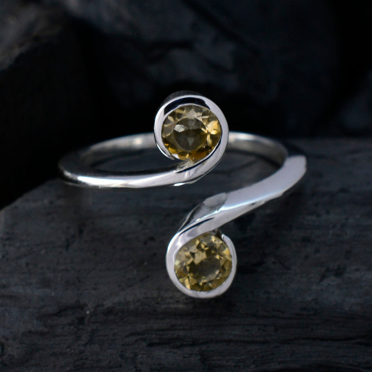 Laura yellow toi et moi ring sterling silver open band with two round yellow gemstones on dark background