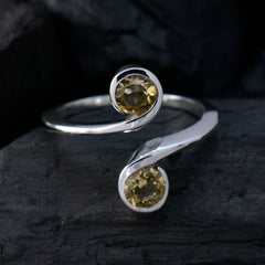 Laura yellow toi et moi ring sterling silver open band with two round yellow gemstones on dark background