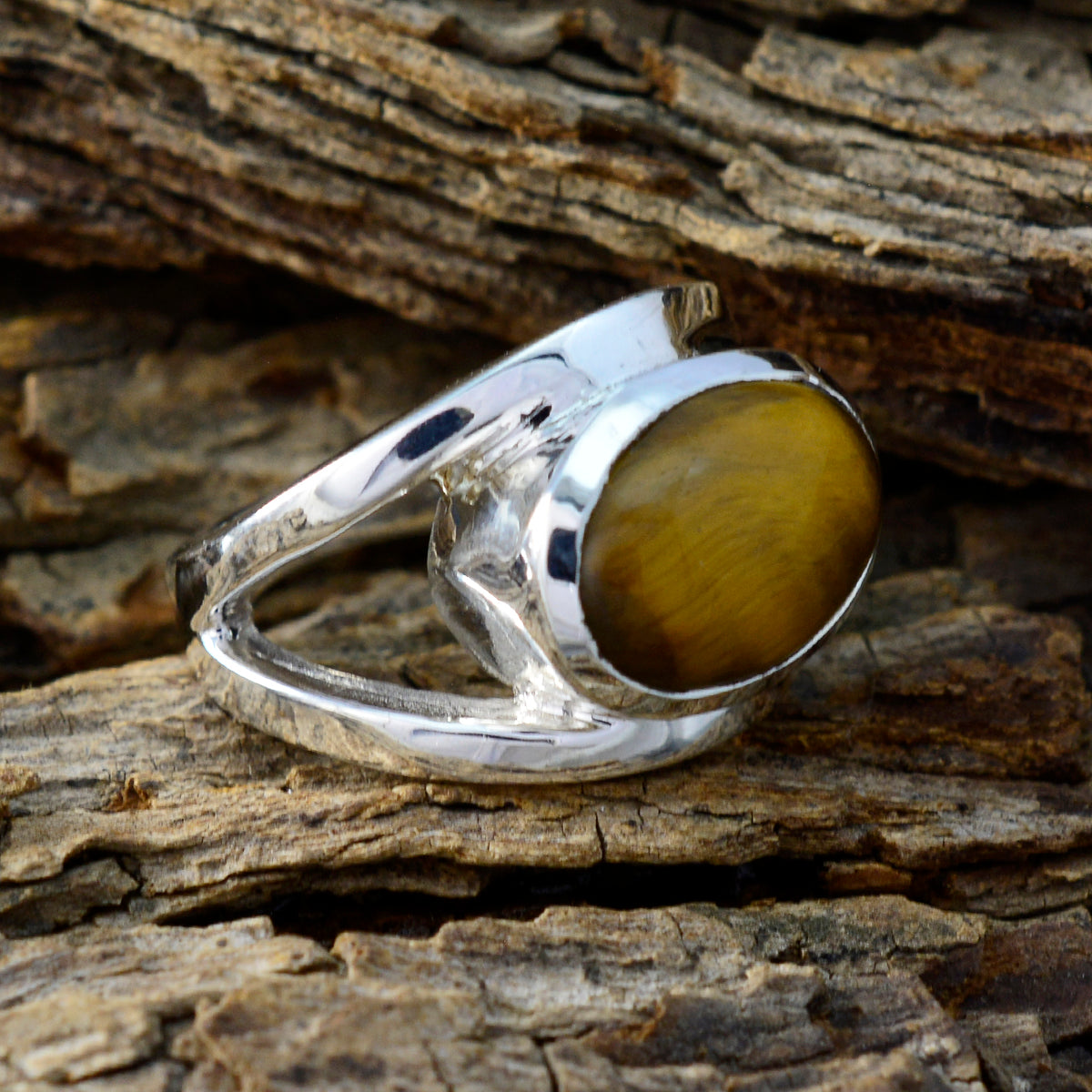 Eva artisan brown solitaire ring with oval brown stone set in polished silver band
