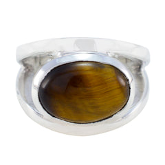 Eva artisan brown solitaire ring with a polished silver band and oval brown stone centerpiece