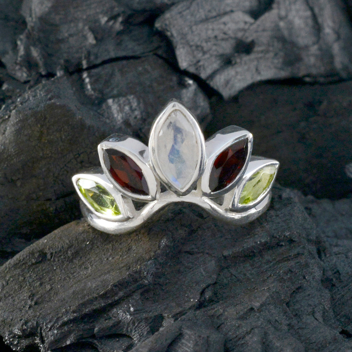 Nari multicolor gemstone crown ring with marquise shaped gems in silver setting on dark textured surface