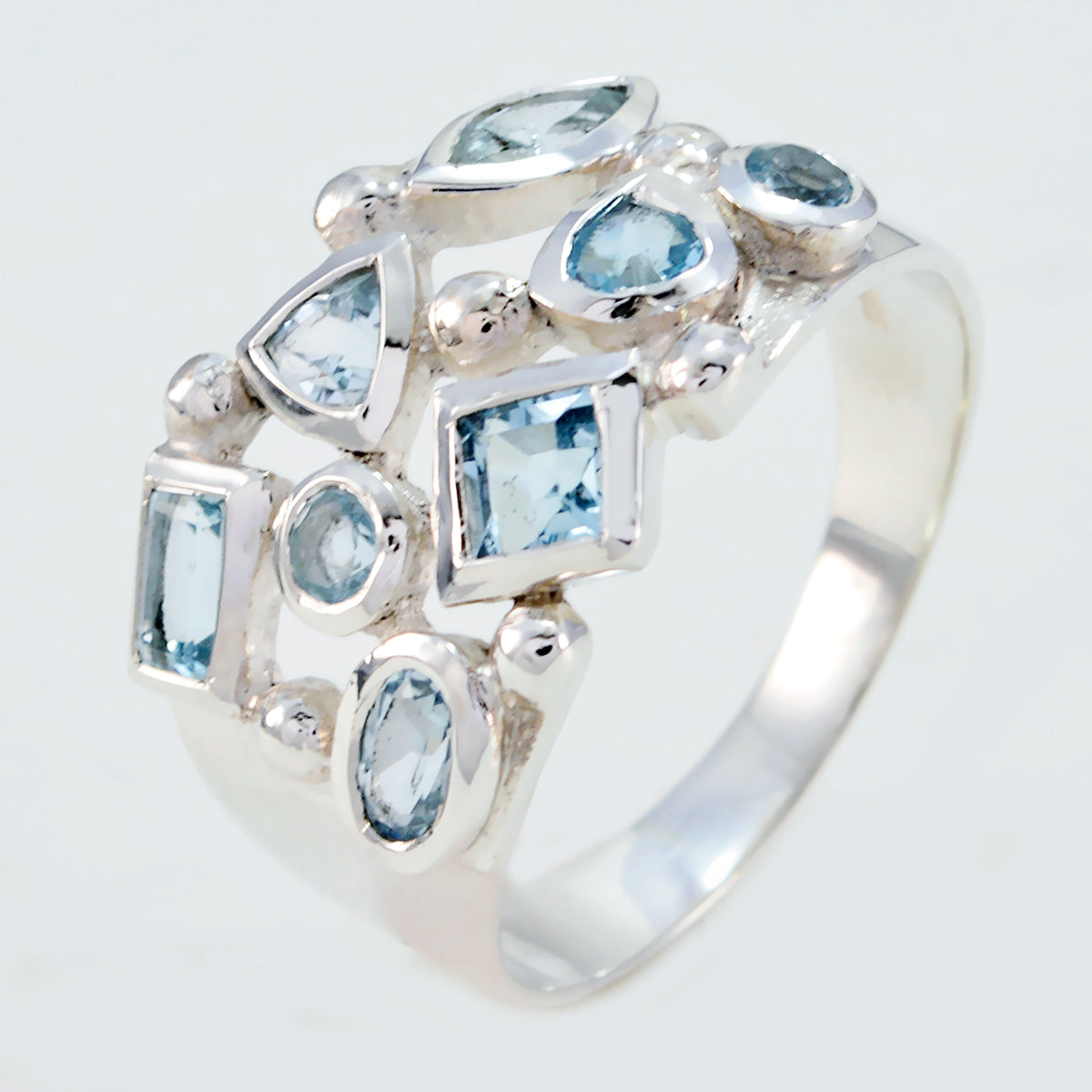 Meera sterling silver trendy blue gemstone ring with multiple light blue cut stones in assorted shapes