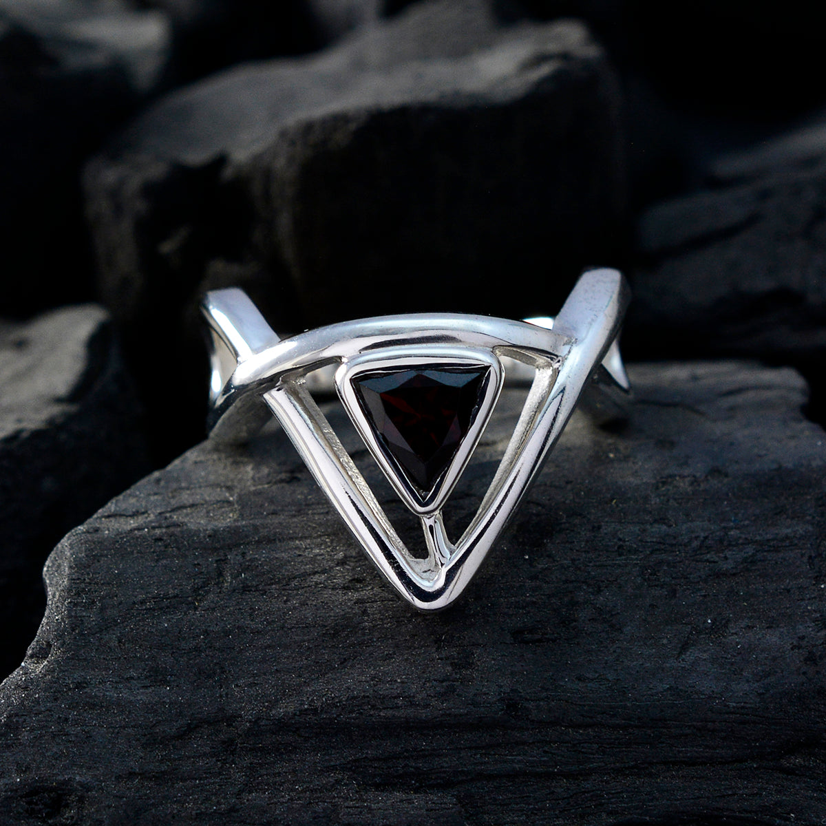 Geometric red solitaire ring with triangular red stone set in silver band by Maria