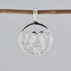 Zoey retro dainty pendant featuring two birds perched on branches in a circular design